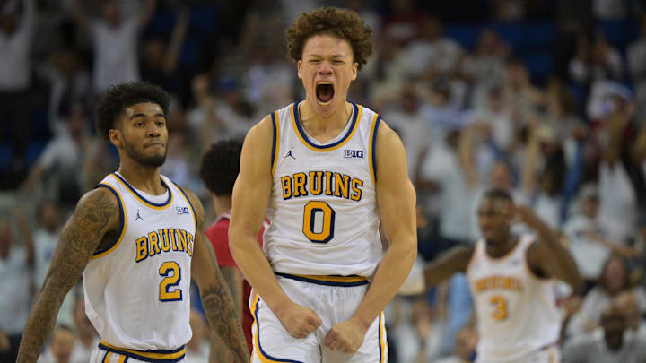Jan 31, 2026; Los Angeles, California, USA;  UCLA Bruins guard Trent Perry (0) reacts after a three-point basket to tie the game with one second in regulation time against the Indiana Hoosiers at Pauley Pavilion presented by Wescom Financial. Mandatory Credit: Jayne Kamin-Oncea-Imagn Images