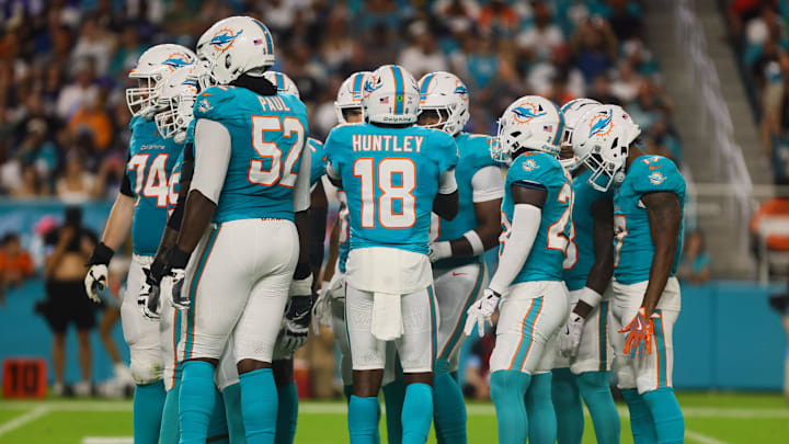 Miami Dolphins quarterback Tyler Huntley (18) talks to his teammates before a play against the Tennessee Titans during the first quarter at Hard Rock Stadium.