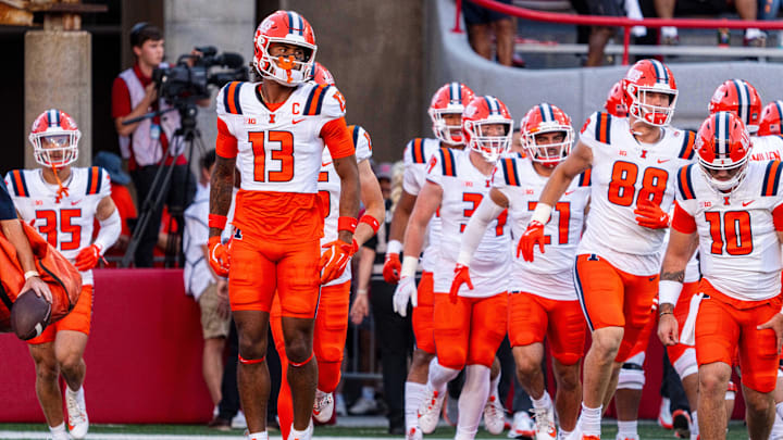 Illinois Fighting Illini wide receiver Pat Bryant (13) runs onto the field