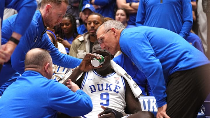 NC State v Duke; Duke basketball center Khaman Maluach sits on the bench as he deals with cramping against NC State