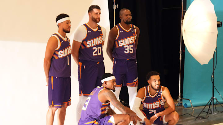 Sep 30, 2024; Phoenix, AZ, USA; Phoenix Suns guard Devin Booker (1) and Phoenix Suns center Jusuf Nurkic (20) and Phoenix Suns forward Kevin Durant (35) and Phoenix Suns guard Bradley Beal (3) and Phoenix Suns guard Tyus Jones (21) pose for a photo during Media Day at Footprint Center. Mandatory Credit: Joe Camporeale-Imagn Images