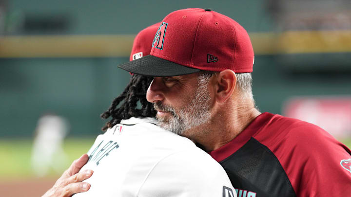 Jul 13, 2024; Phoenix, Arizona, USA; Arizona Diamondbacks manager Torey Lovullo (17) congratulates Arizona Diamondbacks second base Ketel Marte (4) on his selection to the MLB All-Star game prior the game against the Toronto Blue Jays at Chase Field. Mandatory Credit: Joe Camporeale-Imagn Images