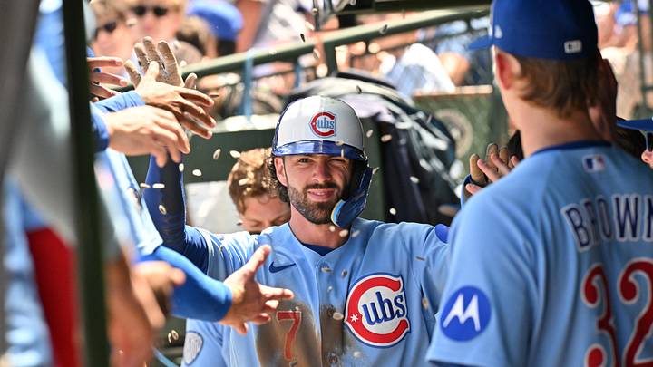 Jun 19, 2026; Chicago, Illinois, USA; Chicago Cubs shortstop Dansby Swanson (7) celebrates with teammates in the dugout after scoring against the Toronto Blue Jays during the first inning at Wrigley Field. Mandatory Credit: Patrick Gorski-Imagn Images