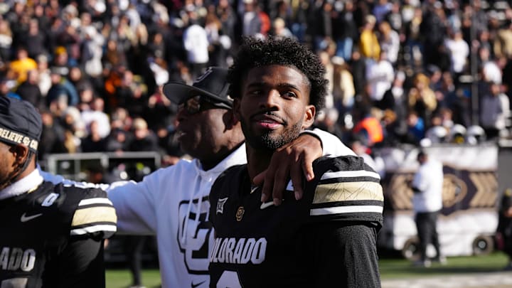 Colorado Buffaloes quarterback Shedeur Sanders (2) and head coach Deion Sanders following the win over the Oklahoma State Cowboys at Folsom Field.  