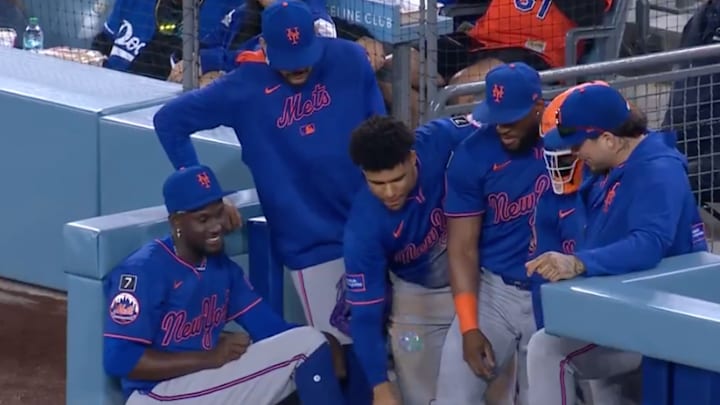 The artist at work as he perfects the bottle flip in front of onlookers. 