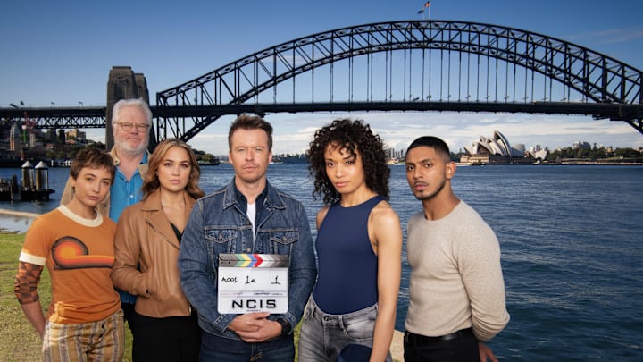 The NCIS:Sydney cast from left to right: Mavournee Hazel as Forensic Pathologist “Bluebird 'Blue' Gleeson, William McInnes as Forensic Pathologist Dr. Roy Penrose, Tuuli Narkle as AFP Liaison Officer Constable Evie Cooper, Todd Lasance as AFP Liaison Officer Sergeant Jim  'JD' Dempsey, Olivia Swann as NCIS Special Agent Captain Michelle Mackey and Sean Sagar as Special Agent DeShawn Jackson. 

PHOTO CREDIT: Daniel Asher Smith/Paramount+   

© TM & © 2023 CBS Studios Inc. NCIS: Sydney and
