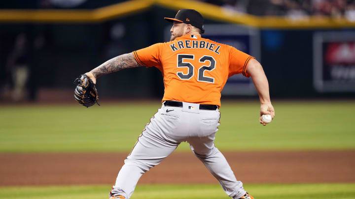 Baltimore Orioles relief pitcher Joey Krehbiel (52) pitches against the Arizona Diamondbacks during the ninth inning at Chase Field in 2023.