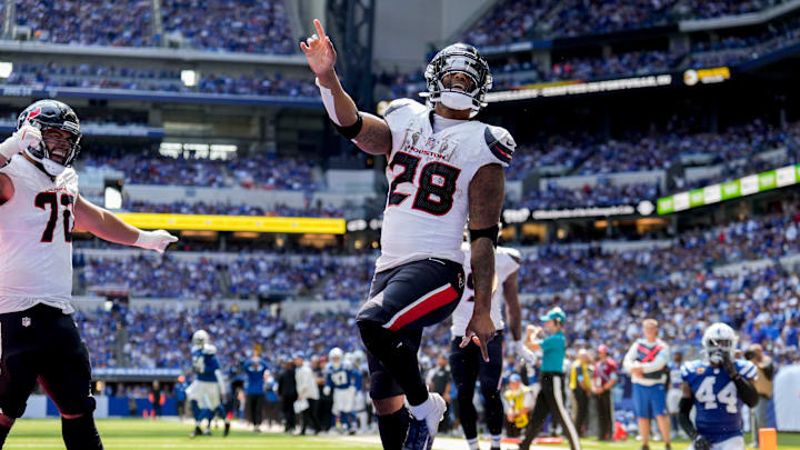 Houston Texans running back Joe Mixon (28) celebrates after scoring a touchdown Sunday, Sept. 8, 2024, during a game against the Indianapolis Colts at Lucas Oil Stadium in Indianapolis.
