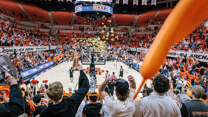 Feb 25, 2025; Stillwater, Oklahoma, USA; Oklahoma State Cowboys fans react at the end of the game against the Iowa State Cyclones at Gallagher-Iba Arena. Mandatory Credit: William Purnell-Imagn Images