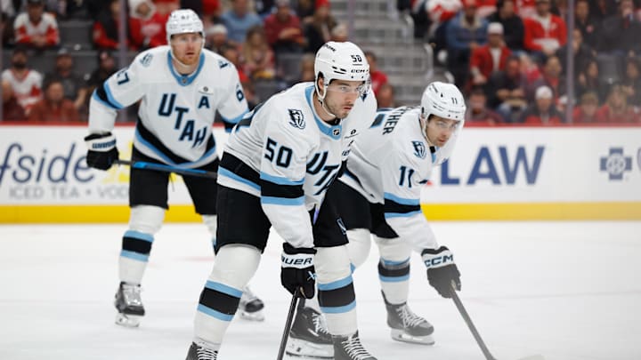 Dec 17, 2025; Detroit, Michigan, USA; Utah Mammoth left wing Lawson Crouse (67) wing Sean Durzi (50) and right wing Dylan Guenther (11) gets set during a face off in the second period against the Detroit Red Wings at Little Caesars Arena. Mandatory Credit: Rick Osentoski-Imagn Images Dec 17, 2025; Detroit, Michigan, USA; Utah Mammoth left wing Lawson Crouse (67) wing Sean Durzi (50) and right wing Dylan Guenther (11) gets set during a face off in the second period against the Detroit Red Wings at Little Caesars Arena. Mandatory Credit: Rick Osentoski-Imagn Images