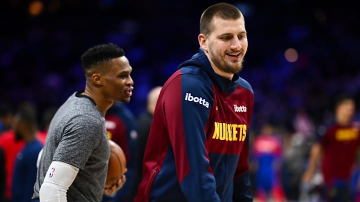 Jan 31, 2025; Philadelphia, Pennsylvania, USA; Denver Nuggets center Nikola Jokic (15) warms up with guard Russell Westbrook (4) before the game against the Philadelphia 76ers at Wells Fargo Center. Mandatory Credit: Kyle Ross-Imagn Images