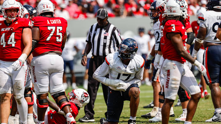 Sep 6, 2025; Raleigh, North Carolina, USA; Virginia Cavaliers wide receiver TyLyric Coleman (17) clutches his hand during the second half of the game against North Carolina State Wolfpack at Carter-Finley Stadium. Mandatory Credit: Jaylynn Nash-Imagn Images