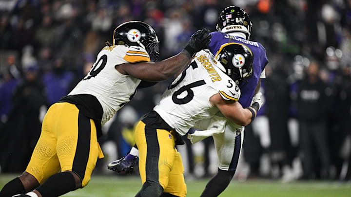 Jan 11, 2025; Baltimore, Maryland, USA; Pittsburgh Steelers defensive tackle Larry Ogunjobi (99) and linebacker Alex Highsmith (56) sack Baltimore Ravens quarterback Lamar Jackson (8) in the third quarter in an AFC wild card game at M&T Bank Stadium. Mandatory Credit: Tommy Gilligan-Imagn Images