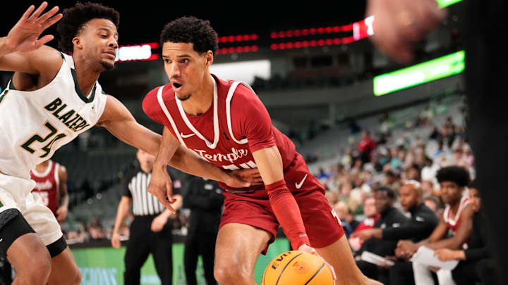 Mar 17, 2024; Fort Worth, TX, USA; Temple Owls forward Steve Settle III (14) drives to the basket as UAB Blazers guard Efrem Johnson (24) defends during the second half at Dickies Arena. Mandatory Credit: Chris Jones-Imagn Images