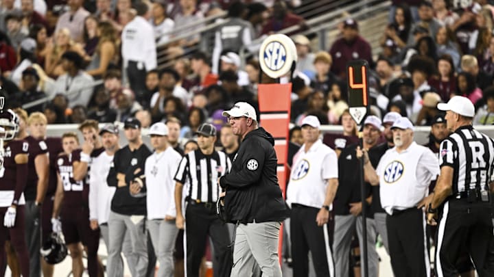 Nov 16, 2024; College Station, Texas, USA; Texas A&M Aggies head coach Mike Elko reacts during the first half against the New Mexico State Aggies at Kyle Field. Mandatory Credit: Maria Lysaker-Imagn Images 