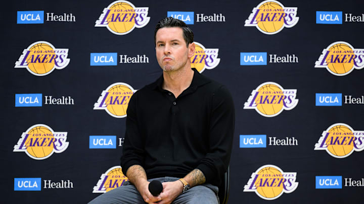 Sep 25, 2025; El Segundo, CA, USA; Los Angeles Lakers head coach JJ Redick, right, looks on during a press conference to preview the 2025-26 season at UCLA Health Training Center. Mandatory Credit: William Liang-Imagn Images Sep 25, 2025; El Segundo, CA, USA; Los Angeles Lakers head coach JJ Redick, right, looks on during a press conference to preview the 2025-26 season at UCLA Health Training Center. Mandatory Credit: William Liang-Imagn Images