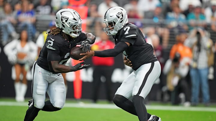 Nov 2, 2025; Paradise, Nevada, USA; Las Vegas Raiders quarterback Geno Smith (7) hands off the ball to Las Vegas Raiders running back Ashton Jeanty (2) during the first quarter against the Jacksonville Jaguars at Allegiant Stadium. Mandatory Credit: Kirby Lee-Imagn Images