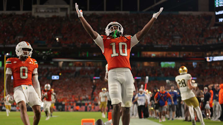 Aug 31, 2025; Miami Gardens, Florida, USA; Miami Hurricanes wide receiver Malachi Toney (10) reacts after scoring a touchdown against the Notre Dame Fighting Irish during the first quarter at Hard Rock Stadium. Mandatory Credit: Sam Navarro-Imagn Images