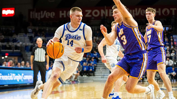 Drake's Bennett Stirtz (14) drives down the court on Wednesday, Jan. 29, 2025, at the Knapp Center. Stirtz played high school basketball at Liberty High School.