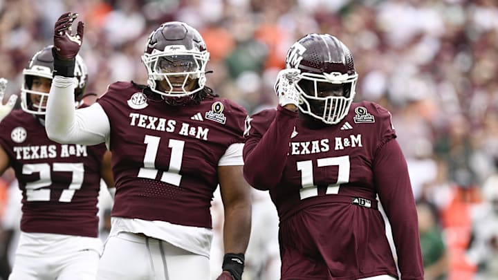 Dec 20, 2025; College Station, TX, USA; Texas A&M Aggies defensive tackle Tyler Onyedim (11) celebrates a sack with defensive tackle Albert Regis (17) during first half of the first round game of the CFP National Playoff against the Miami Hurricanes at Kyle Field. Mandatory Credit: Jerome Miron-Imagn Images Dec 20, 2025; College Station, TX, USA; Texas A&M Aggies defensive tackle Tyler Onyedim (11) celebrates a sack with defensive tackle Albert Regis (17) during first half of the first round game of the CFP National Playoff against the Miami Hurricanes at Kyle Field. Mandatory Credit: Jerome Miron-Imagn Images