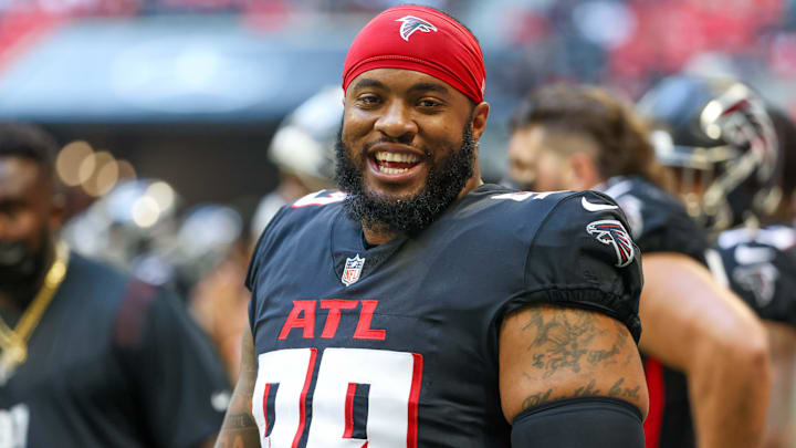 Aug 13, 2021; Atlanta, Georgia, USA; Atlanta Falcons defensive end Jonathan Bullard (99) talks with teammates on the sideline during their game against the Tennessee Titans at Mercedes-Benz Stadium. Mandatory Credit: Jason Getz-Imagn Images
