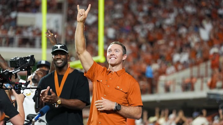Sep 21, 2024; Austin, Texas, USA; Former Texas Longhorns quarterback Colt McCoy acknowledges the crowd after being introduced as a member of the Texas Longhorns Hall of Fame during the first half of the game against the Louisiana Monroe Warhawks at Darrell K Royal-Texas Memorial Stadium. Mandatory Credit: Daniel Dunn-Imagn Images Sep 21, 2024; Austin, Texas, USA; Former Texas Longhorns quarterback Colt McCoy acknowledges the crowd after being introduced as a member of the Texas Longhorns Hall of Fame during the first half of the game against the Louisiana Monroe Warhawks at Darrell K Royal-Texas Memorial Stadium. Mandatory Credit: Daniel Dunn-Imagn Images
