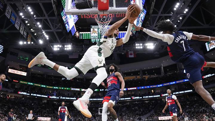 Dec 31, 2025; Milwaukee, Wisconsin, USA; Washington Wizards guard Bub Carrington (7) defends Milwaukee Bucks forward Giannis Antetokounmpo (34) during the fourth quarter at Fiserv Forum. Mandatory Credit: Jeff Hanisch-Imagn Images Dec 31, 2025; Milwaukee, Wisconsin, USA; Washington Wizards guard Bub Carrington (7) defends Milwaukee Bucks forward Giannis Antetokounmpo (34) during the fourth quarter at Fiserv Forum. Mandatory Credit: Jeff Hanisch-Imagn Images