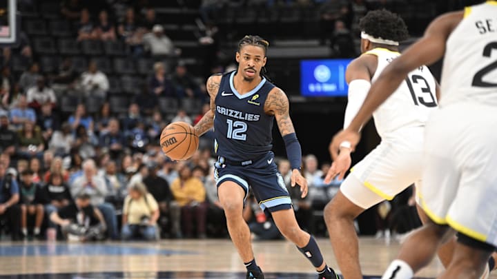 Mar 12, 2025; Memphis, Tennessee, USA; Memphis Grizzlies point guard Ja Morant (12) dribbles at the top of key during the Memphis Grizzlies vs. Utah Jazz game at FedExForum. Mandatory Credit: Matthew Smith-Imagn Images