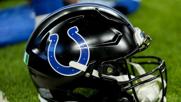 A black Indianapolis Colts helmet sits on the turf Sunday, Nov. 24, 2024, during a game against the Detroit Lions at Lucas Oil Stadium in Indianapolis.