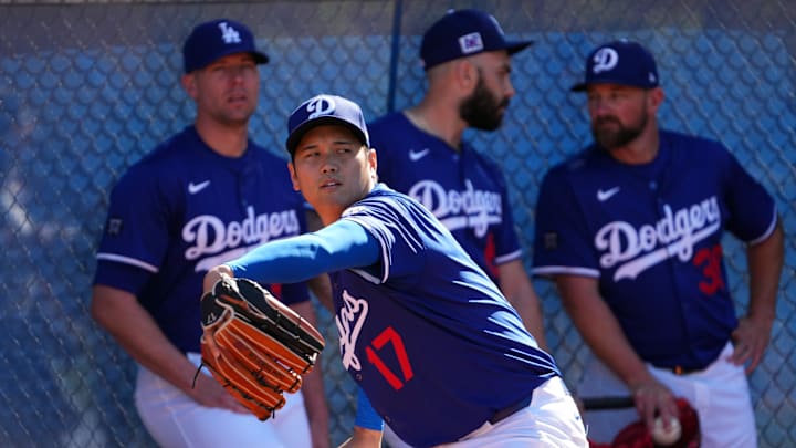 Feb 15, 2025; Glendale, AZ, USA; Los Angeles Dodgers two-way player Shohei Ohtani (17) throws during a Spring Training workout at Camelback Ranch. Mandatory Credit: Joe Camporeale-Imagn Images