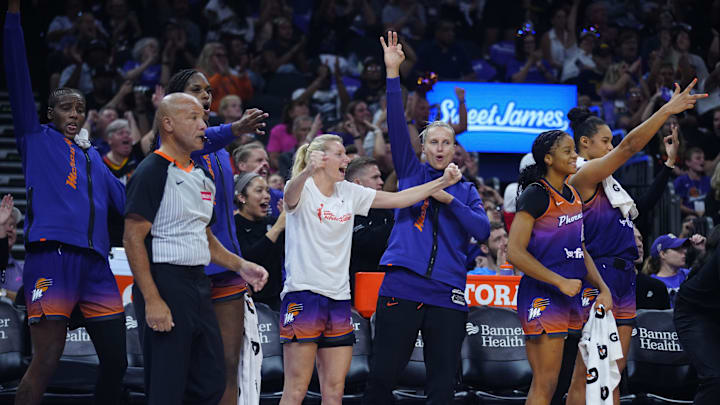 Mercury guards Lexie Held (center white) and Kitija Laska (center purple) celebrate a basket at PHX Arena in Phoenix on Aug. 7, 2025.