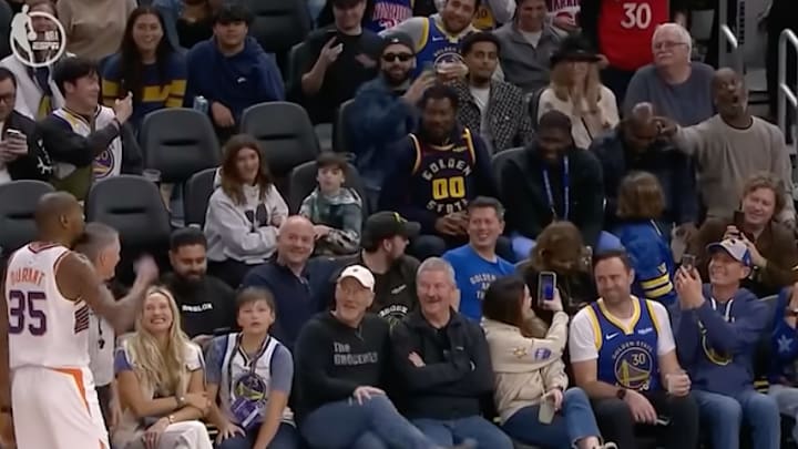Durant and Payton (upper right corner) exchange words during the Suns-Warriors game. 