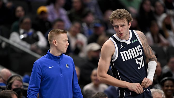 Jan 27, 2025; Dallas, Texas, USA; Dallas Mavericks center Kylor Kelley (50) talks with assistant coach Sean Sweeney during the second half of the game against the Washington Wizards at the American Airlines Center. Mandatory Credit: Jerome Miron-Imagn Images