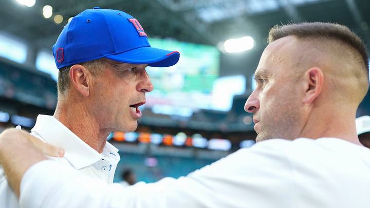 New York Giants head coach John Harbaugh and Miami Dolphins head coach Jeff Hafley New York Giants head coach John Harbaugh and Miami Dolphins head coach Jeff Hafley