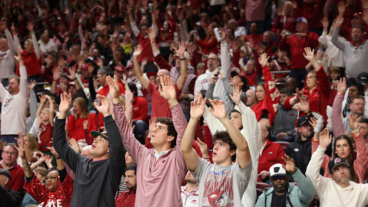 Dec 6, 2025; North Little Rock, Arkansas, USA; Arkansas Razorbacks fans cheer during the second half against the Fresno State Bulldogs at Simmons Bank Arena. Arkansas won 82-58. Mandatory Credit: Nelson Chenault-Imagn Images Dec 6, 2025; North Little Rock, Arkansas, USA; Arkansas Razorbacks fans cheer during the second half against the Fresno State Bulldogs at Simmons Bank Arena. Arkansas won 82-58. Mandatory Credit: Nelson Chenault-Imagn Images
