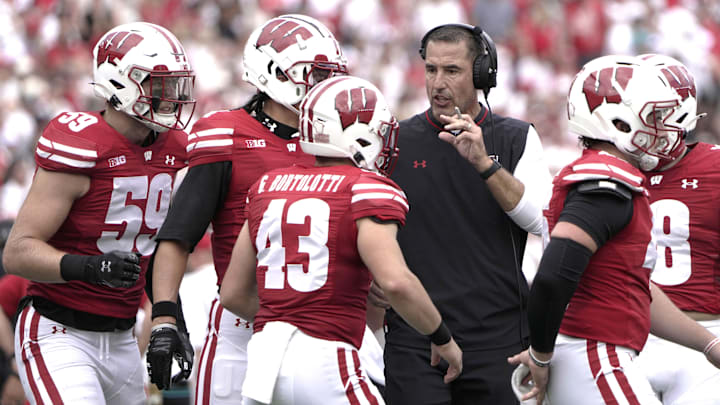 Sep 20, 2025; Madison, Wisconsin, USA; Wisconsin Badgers head coach Luke Fickell talks to his players during the second quarter of their game against the Maryland Terrapins at Camp Randall Stadium. Mandatory Credit: Mark Hoffman/USA Today Network via Imagn Images