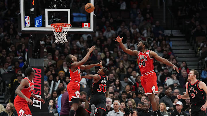Jan 31, 2025; Toronto, Ontario, CAN:Toronto Raptors guard Ochai Agbaji (30) drives to the basket as Chicago Bulls forward Patrick Williams (44) tries to block during the fourth quarter at Scotiabank Arena. Mandatory Credit: Nick Turchiaro-Imagn Images