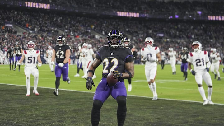 Dec 21, 2025; Baltimore, Maryland, USA;  Baltimore Ravens running back Derrick Henry (22) runs for a touchdown against the New England Patriots during the first quarter at M&T Bank Stadium. Mandatory Credit: Mitch Stringer-Imagn Images