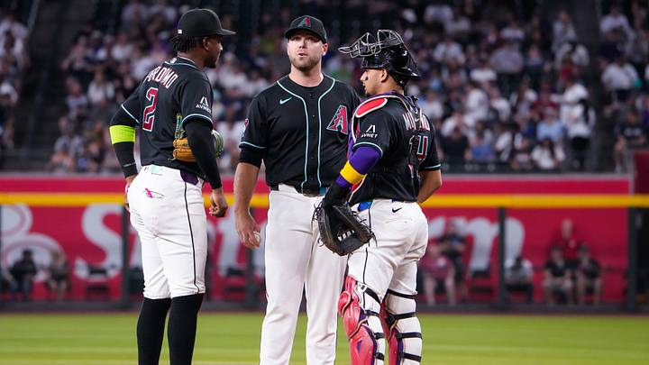Sep 20, 2026; Phoenix, Arizona, USA; Arizona Diamondbacks shortstop Geraldo Perdomo (2), Arizona pitcher Corbin Burnes (39) and catcher Gabriel Moreno (14) meet at the mound during the first inning at Chase Field during the game between Arizona Diamondbacks and the New York Yankees. Mandatory Credit: Arianna Grainey-Imagn Images Sep 20, 2026; Phoenix, Arizona, USA; Arizona Diamondbacks shortstop Geraldo Perdomo (2), Arizona pitcher Corbin Burnes (39) and catcher Gabriel Moreno (14) meet at the mound during the first inning at Chase Field during the game between Arizona Diamondbacks and the New York Yankees. Mandatory Credit: Arianna Grainey-Imagn Images
