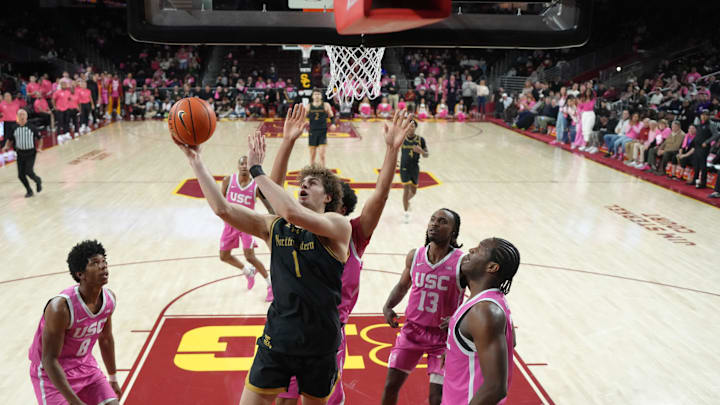 Jan 21, 2026; Los Angeles, California, USA; Northwestern Wildcats forward Tyler Kropp (1) shoots the ball against Southern California Trojans guard Jerry Easter II (8), guard Kam Woods (13) and forward Ezra Ausar (2) in the second half at Galen Center. Mandatory Credit: Kirby Lee-Imagn Images Jan 21, 2026; Los Angeles, California, USA; Northwestern Wildcats forward Tyler Kropp (1) shoots the ball against Southern California Trojans guard Jerry Easter II (8), guard Kam Woods (13) and forward Ezra Ausar (2) in the second half at Galen Center. Mandatory Credit: Kirby Lee-Imagn Images