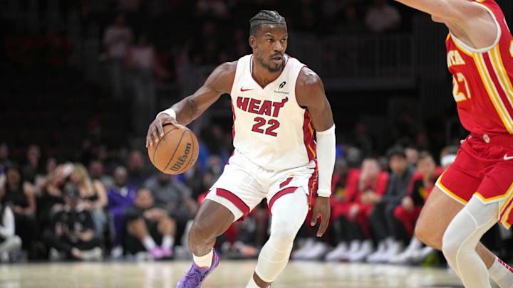 Oct 16, 2024; Miami, Florida, USA; Miami Heat forward Jimmy Butler (22) brings the ball up the court as Atlanta Hawks guard Vit Krejci (27) defends in the first half at Kaseya Center. Mandatory Credit: Jim Rassol-Imagn Images