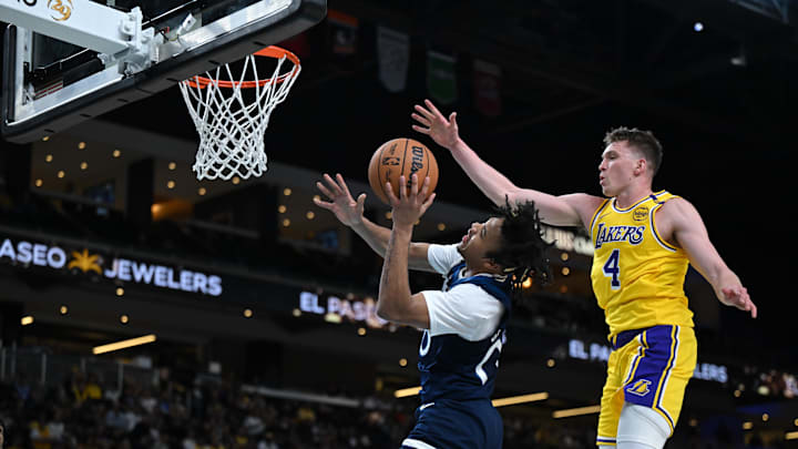 Oct 4, 2024; Palm Desert, California, USA; Minnesota Timberwolves guard Terrence Shannon Jr. (00) shoots a layup against Los Angeles Lakers guard Dalton Knecht (4) during the second half at Acrisure Arena. Mandatory Credit: Jonathan Hui-Imagn Images