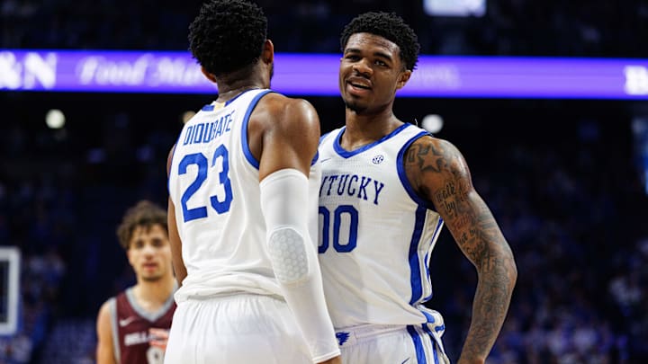 Dec 23, 2025; Lexington, Kentucky, USA; Kentucky Wildcats guard Otega Oweh (00) chest bumps forward Mouhamed Dioubate (23) during the first half against the Bellarmine Knights at Rupp Arena at Central Bank Center. Mandatory Credit: Jordan Prather-Imagn Images
