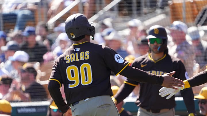 Feb 23, 2025; Phoenix, Arizona, USA; San Diego Padres catcher Ethan Salas (90) scores a run against the Los Angeles Dodgers during the second inning at Camelback Ranch-Glendale. 