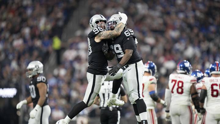 November 5, 2023; Paradise, Nevada, USA; Las Vegas Raiders defensive end Maxx Crosby (98) and defensive tackle Adam Butler (69) celebrate after sacking New York Giants quarterback Tommy DeVito (not pictured) during the third quarter at Allegiant Stadium. Mandatory Credit: Kyle Terada-USA TODAY Sports