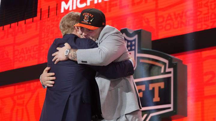 Apr 24, 2025; Green Bay, WI, USA; NFL commissioner Roger Goodell with Michigan Wolverines defensive lineman Mason Graham after he is selected by the Cleveland Browns as the number five pick in the first round of the 2025 NFL Draft at Lambeau Field. Mandatory Credit: Kirby Lee-Imagn Images
