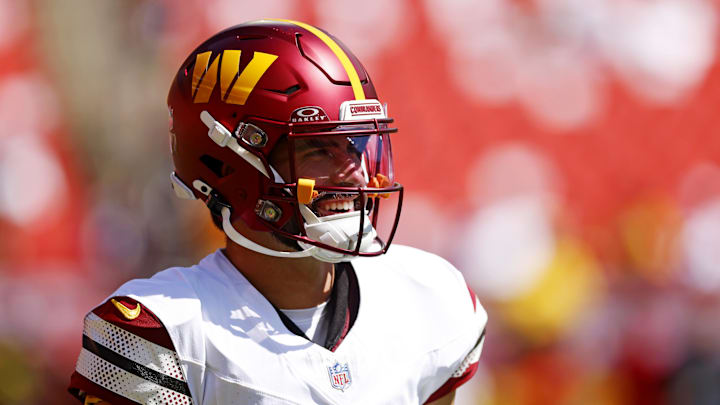 Washington Commanders quarterback Sam Hartman warms up before playing against the Baltimore Ravens.