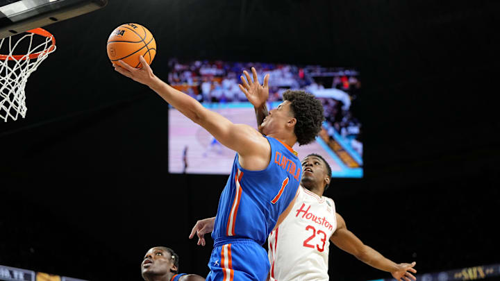 Florida Gators guard Walter Clayton Jr. (1) shoots the ball as Houston Cougars guard Terrance Arceneaux (23) attempts a block during the second half of the national championship game of the Final Four of the 2025 NCAA Tournament at the Alamodome. Florida Gators guard Walter Clayton Jr. (1) shoots the ball as Houston Cougars guard Terrance Arceneaux (23) attempts a block during the second half of the national championship game of the Final Four of the 2025 NCAA Tournament at the Alamodome.