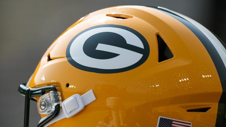 Aug 24, 2024; Green Bay, Wisconsin, USA; General view of a Green Bay Packers helmet during warmups prior to the game against the Baltimore Ravens at Lambeau Field. Mandatory Credit: Jeff Hanisch-Imagn Images Aug 24, 2024; Green Bay, Wisconsin, USA; General view of a Green Bay Packers helmet during warmups prior to the game against the Baltimore Ravens at Lambeau Field. Mandatory Credit: Jeff Hanisch-Imagn Images