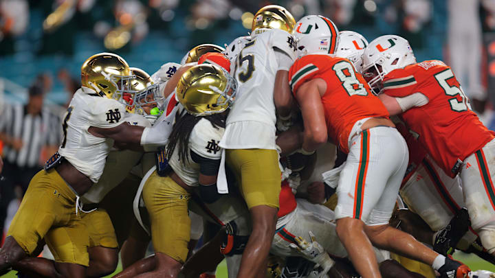 Aug 31, 2025; Miami Gardens, Florida, USA; Miami Hurricanes running back CharMar Brown (6) scores a touchdown against the Notre Dame Fighting Irish during the third quarter at Hard Rock Stadium. Mandatory Credit: Sam Navarro-Imagn Images